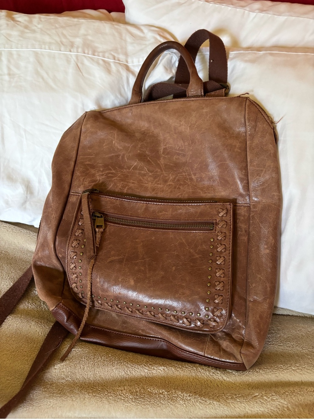 The Sak Distressed Brown Leather-Style Backpack with Studded Front Pocket